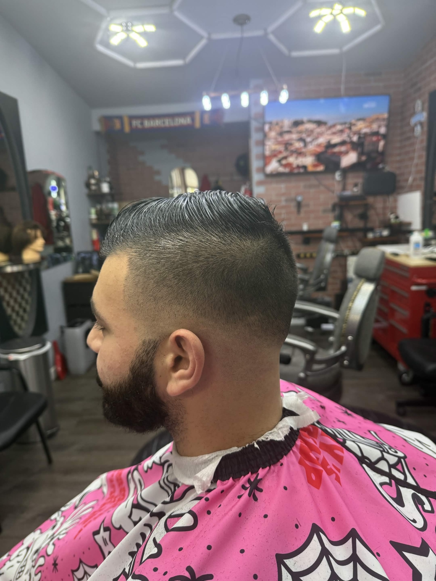 High skin fade with beard blend